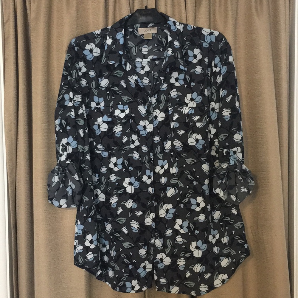 Floral button up blouse.